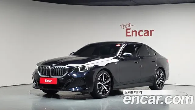BMW 5-Series 2024 — photo 1