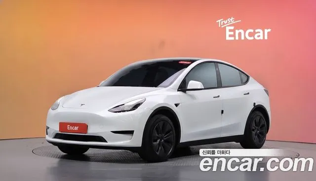 Tesla Model Y 2024 — photo 1