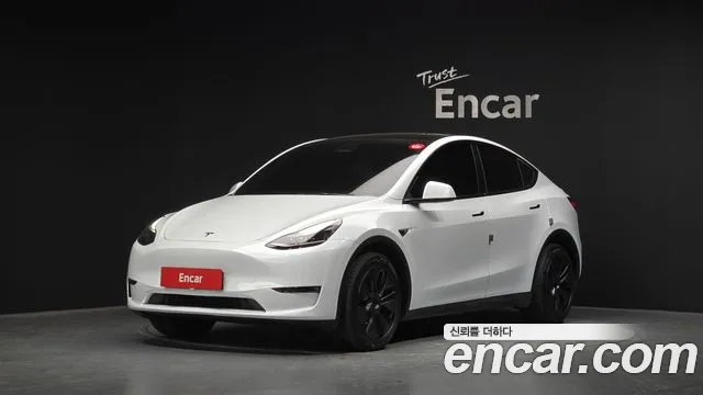 Tesla Model Y 2024 — photo 1