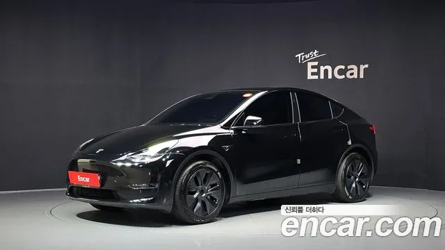 Tesla Model Y 2024 — photo 1
