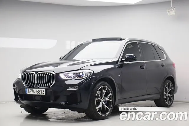 BMW X5 2021 — photo 1