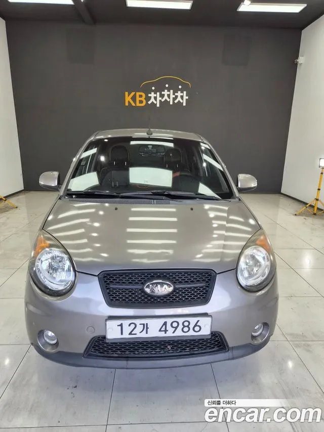 Kia morning 2011 — photo 1