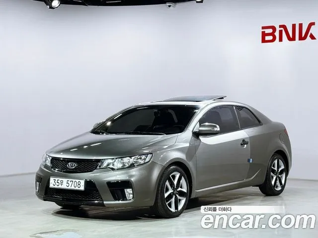 Kia Porte 2010 — photo 1
