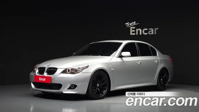 BMW 5-Series 2009 — photo 1