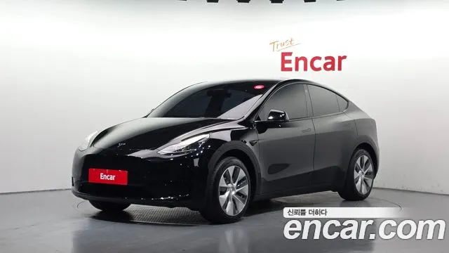 Tesla Model Y 2024 — photo 1