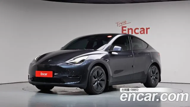 Tesla Model Y 2024 — photo 1