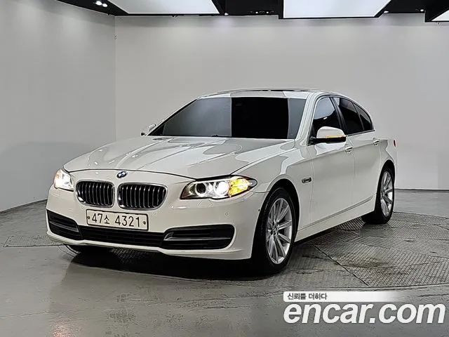 BMW 5-Series 2014 — photo 1