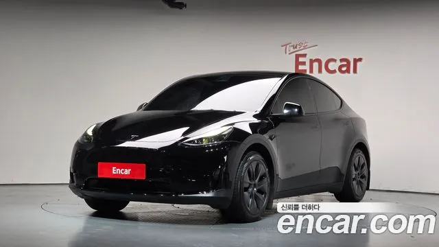Tesla Model Y 2024 — photo 1