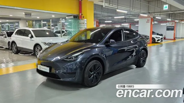 Tesla Model Y 2024 — photo 1