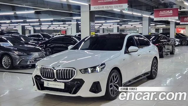 BMW 5-Series 2024 — photo 1