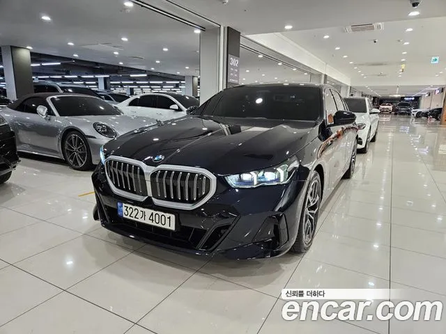 BMW 5-Series 2024 — photo 1