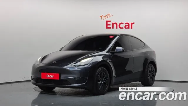 Tesla Model Y 2024 — photo 1