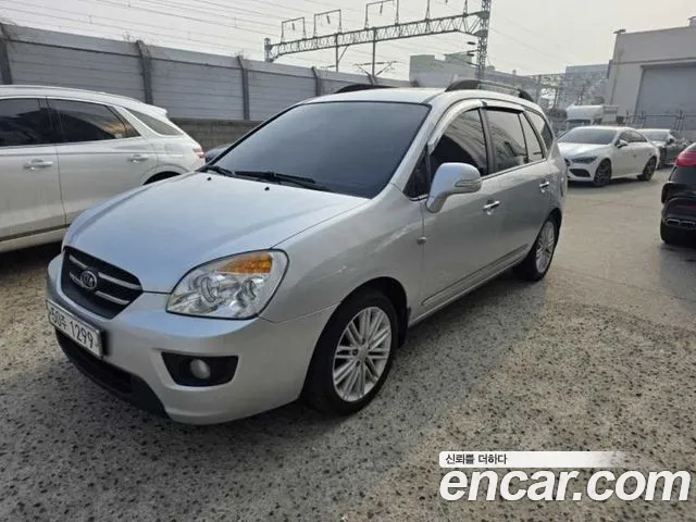 Kia Carens 2010 — photo 1