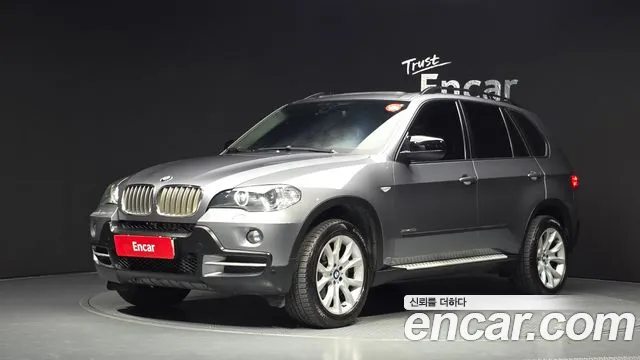 BMW X5 2010 — photo 1