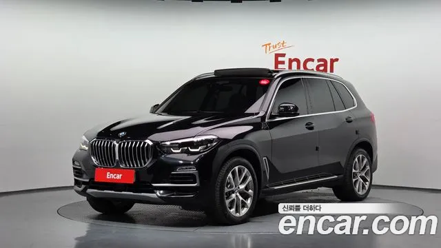 BMW X5 2021 — photo 1