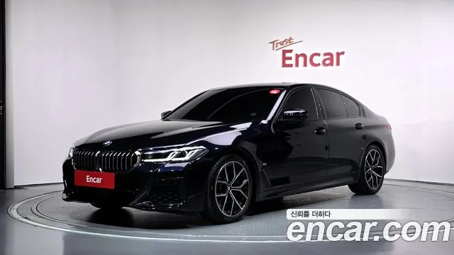 BMW 5-Series 2023 — photo 1
