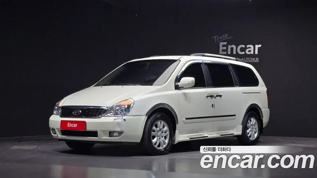 Kia Canival 2010 — photo 1