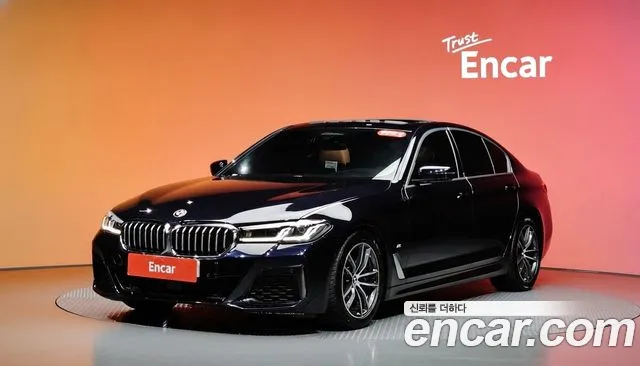 BMW 5-Series 2023 — photo 1