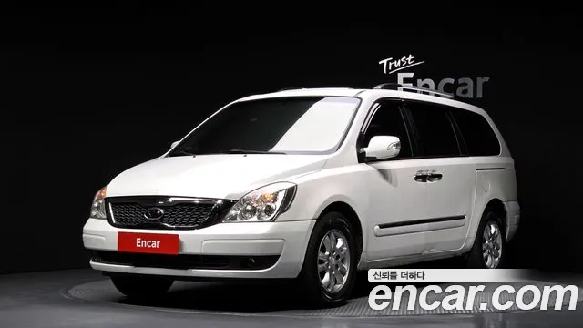 Kia Canival 2012 — photo 1