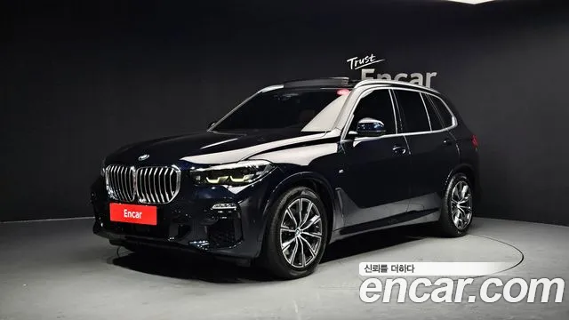 BMW X5 2021 — photo 1
