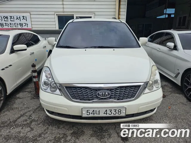 Kia Canival 2010 — photo 1