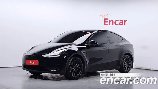 Tesla Model Y 2024 — photo 1
