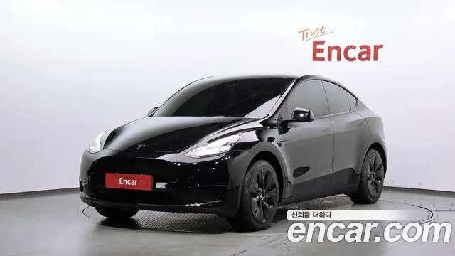 Tesla Model Y 2024 — photo 1