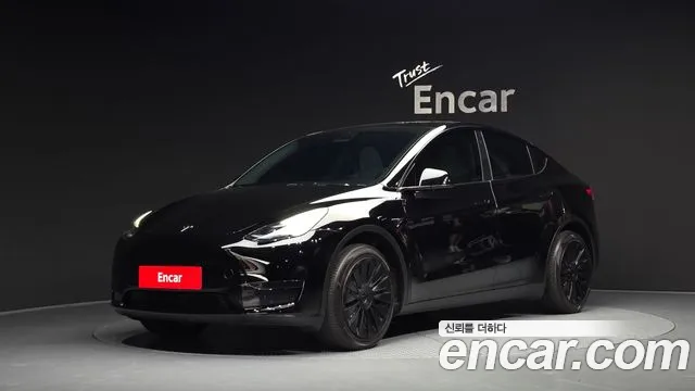 Tesla Model Y 2024 — photo 1