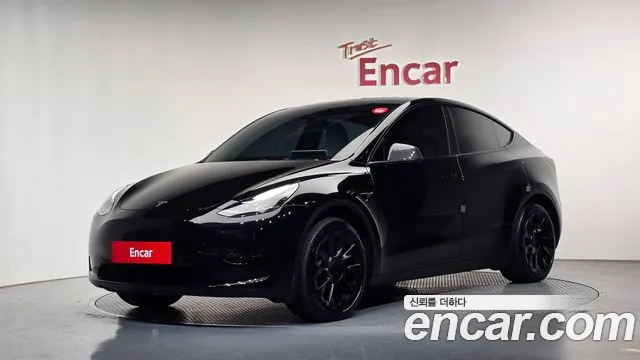 Tesla Model Y 2024 — photo 1