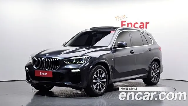BMW X5 2021 — photo 1