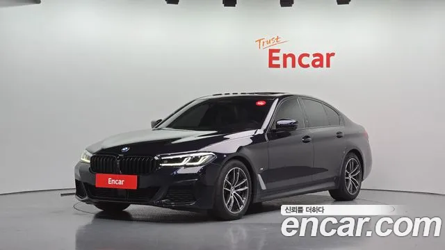 BMW 5-Series 2023 — photo 1