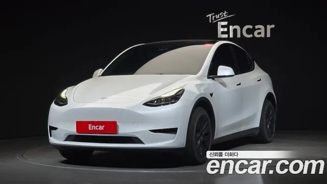 Tesla Model Y 2024 — photo 1