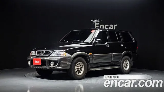 KG Mobility Musso 2002 — photo 1