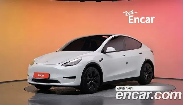 Tesla Model Y 2024 — photo 1