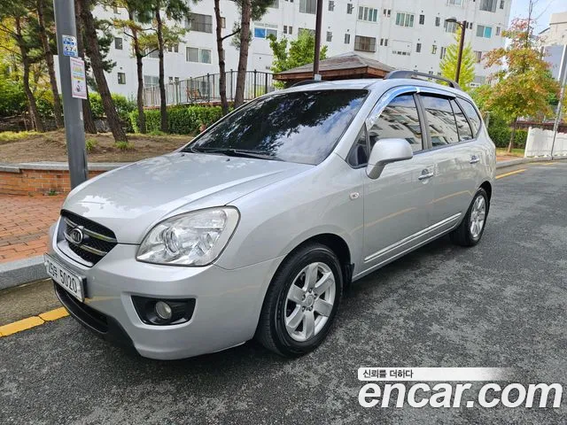Kia Carens 2009 — photo 1