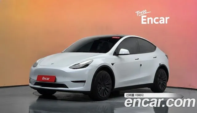 Tesla Model Y 2024 — photo 1