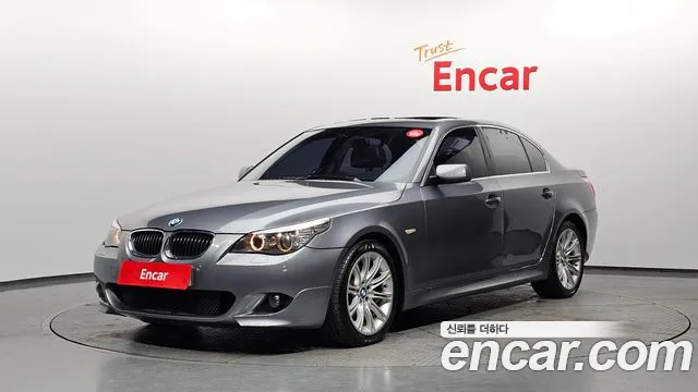 BMW 5-Series 2009 — photo 1