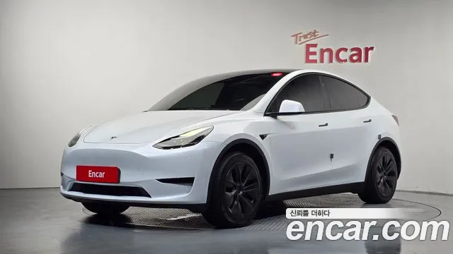 Tesla Model Y 2024 — photo 1