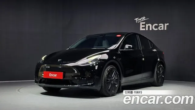 Tesla Model Y 2024 — photo 1