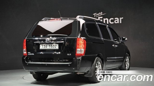 Kia Canival 2013 — photo 2