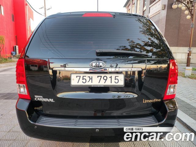 Kia Canival 2012 — photo 2