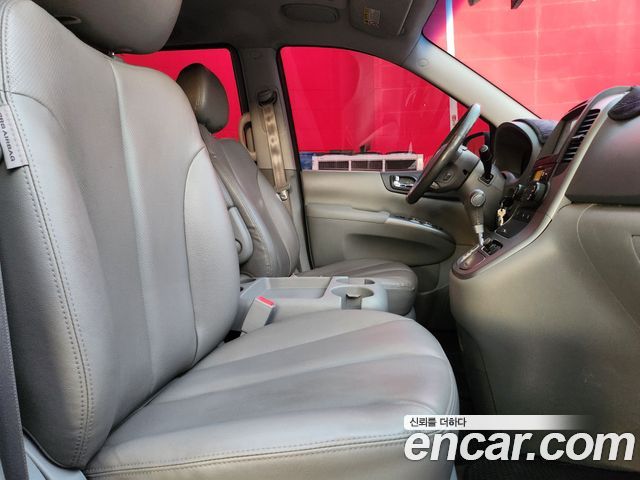 Kia Canival 2012 — photo 14