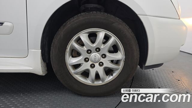Kia Canival 2012 — photo 28