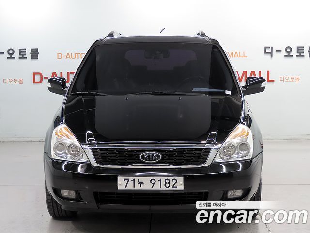 Kia Canival 2012 — photo 2