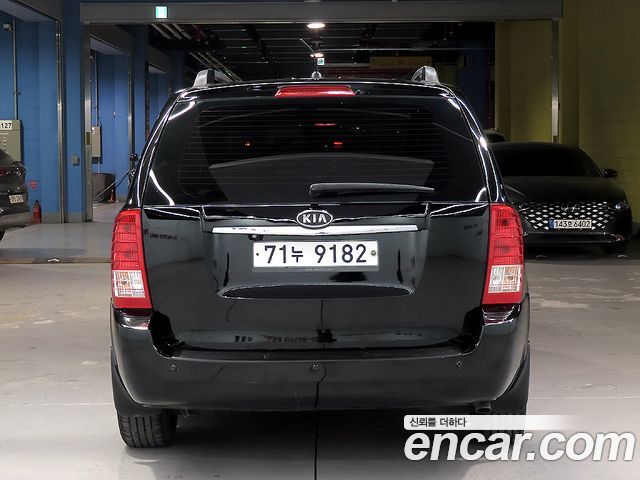 Kia Canival 2012 — photo 3