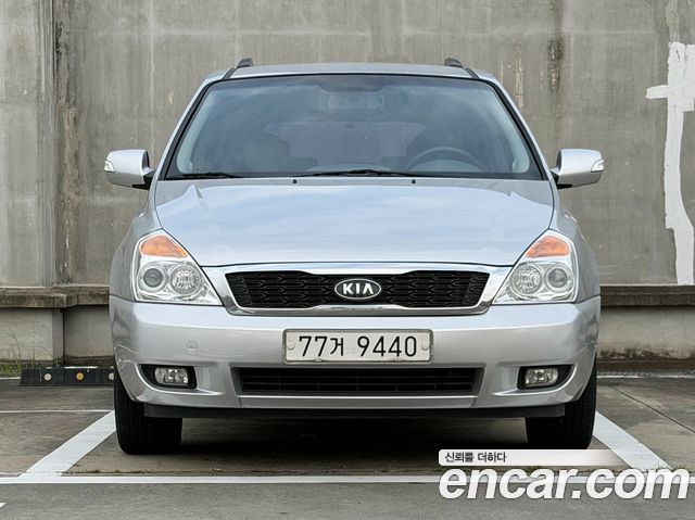 Kia Canival 2012 — photo 2
