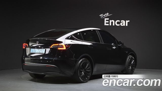 Tesla Model Y 2024 — photo 2