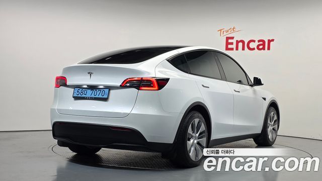Tesla Model Y 2024 — photo 2