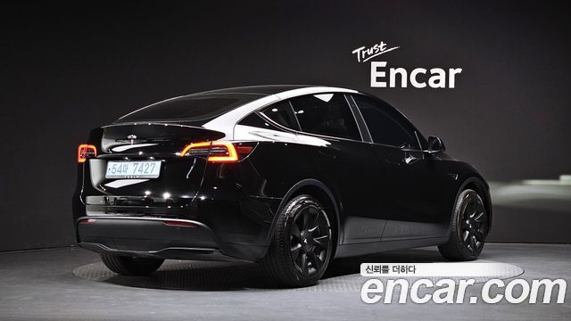 Tesla Model Y 2024 — photo 2