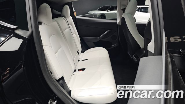 Tesla Model Y 2024 — photo 17